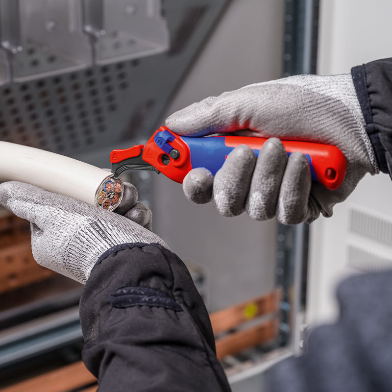 Couteau à dégainer avec sabot de guidage de Knipex